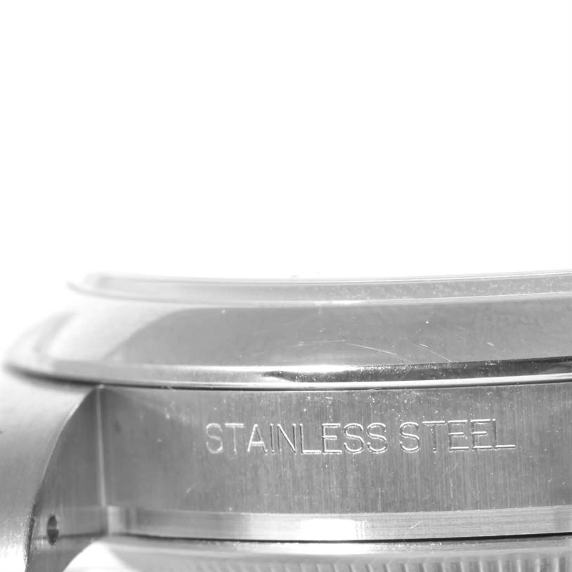 The image shows a close-up of the stainless steel side casing of a Rolex Air-King 114200 Men's Stainless Steel Silver Dial 114200 Men's Stainless Steel Silver Dial watch.