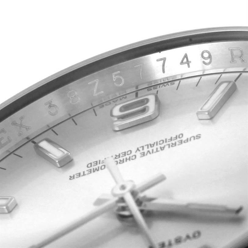 This image shows a close-up of the dial, hour markers, hands, and the inner bezel of a Rolex Air-King 114200 Men's Stainless Steel Silver Dial 114200 Men's Stainless Steel Silver Dial watch from an angled perspective.