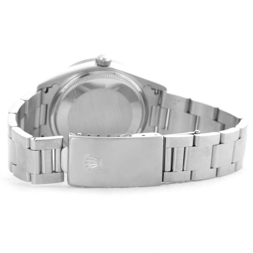 The image shows the back and clasp of a Rolex Air-King 14010 Men's Stainless Steel Silver Dial 14010 Men's Stainless Steel Silver Dial watch, highlighting its stainless steel bracelet and closed case back.