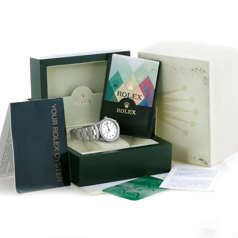 The image shows the Rolex Air-King 14010 Men's Stainless Steel Silver Dial 14010 Men's Stainless Steel Silver Dial watch at an angle in its open box, alongside manuals, warranty card, and original packaging.