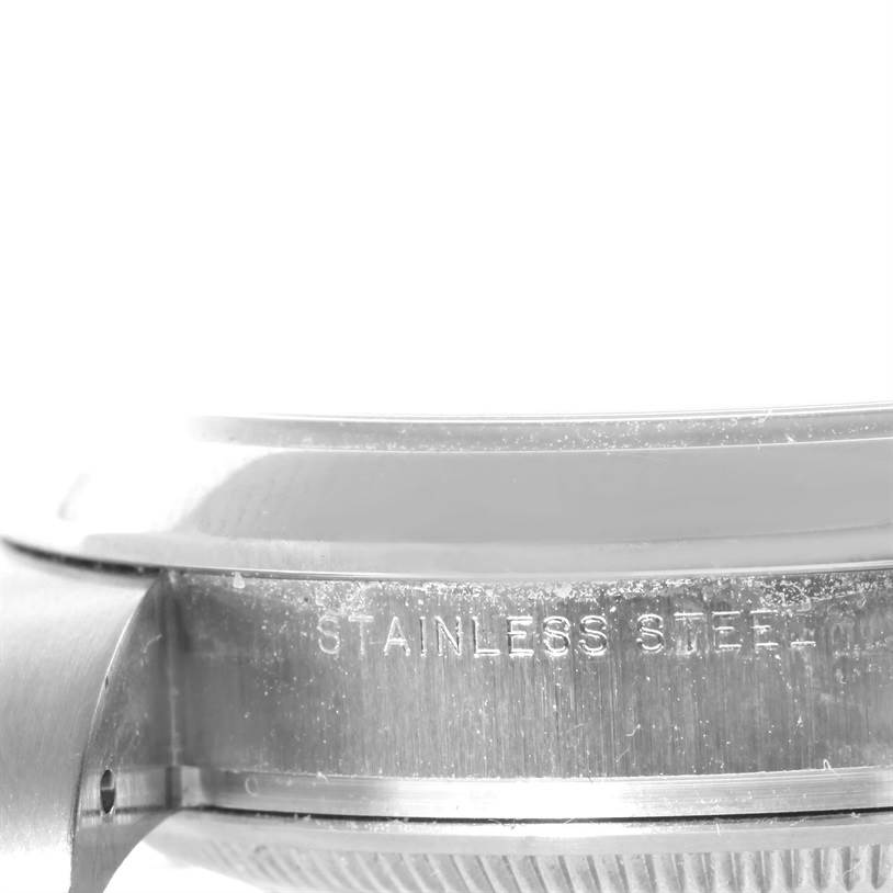 The image shows a close-up of the stainless steel side and lugs of a Rolex Air-King 114200 Men's Stainless Steel Silver Dial 114200 Men's Stainless Steel Silver Dial watch.
