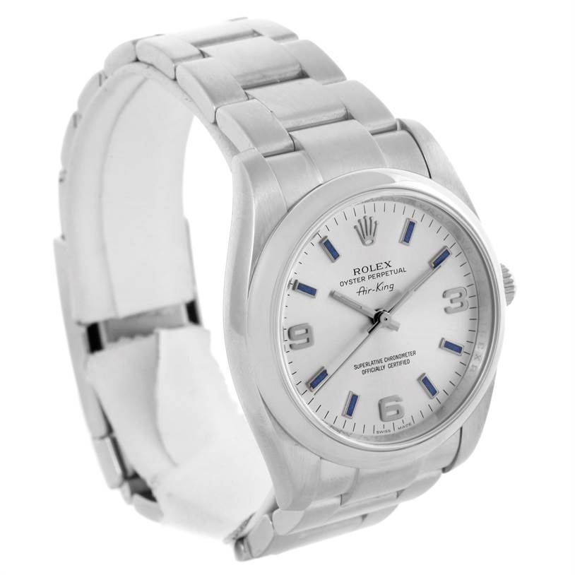 This Rolex Air-King 114200 Men's Stainless Steel Silver Dial 114200 Men's Stainless Steel Silver Dial watch is shown at a three-quarter angle, displaying its face, bracelet, and part of the clasp.