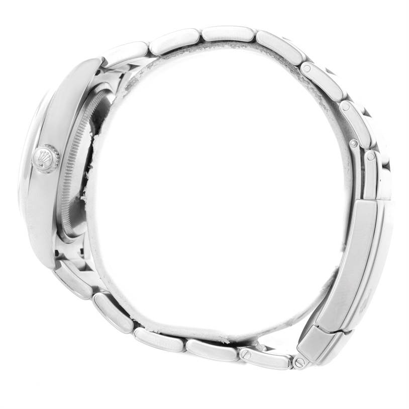 This is a side view of the Rolex Air-King 114200 Men's Stainless Steel Silver Dial 114200 Men's Stainless Steel Silver Dial watch, showing the case, crown, and bracelet.