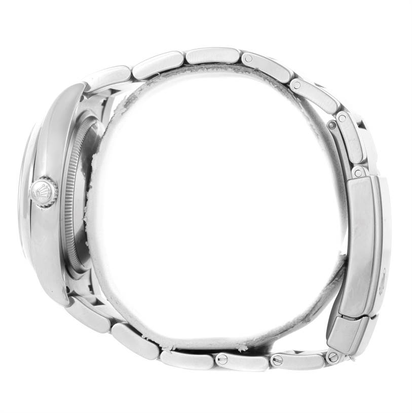 The image shows the side profile of a Rolex Air-King 114200 Men's Stainless Steel Silver Dial 114200 Men's Stainless Steel Silver Dial watch, highlighting the case, crown, and bracelet links.