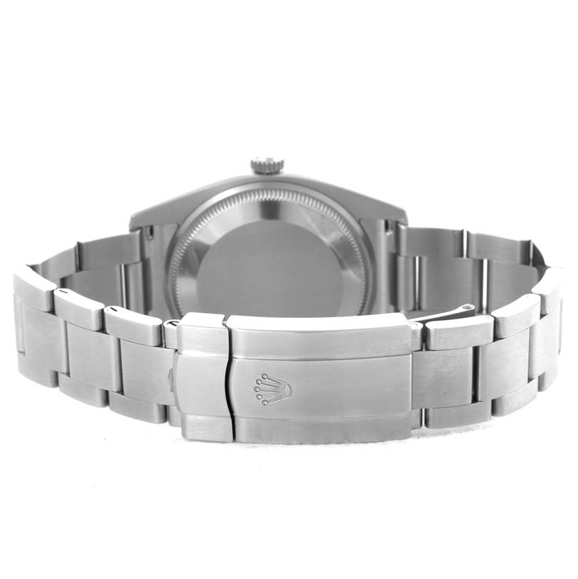 This is the back view of a Rolex Air-King 114200 Men's Stainless Steel Silver Dial 114200 Men's Stainless Steel Silver Dial watch showing the case back, crown, and stainless steel bracelet with the clasp.