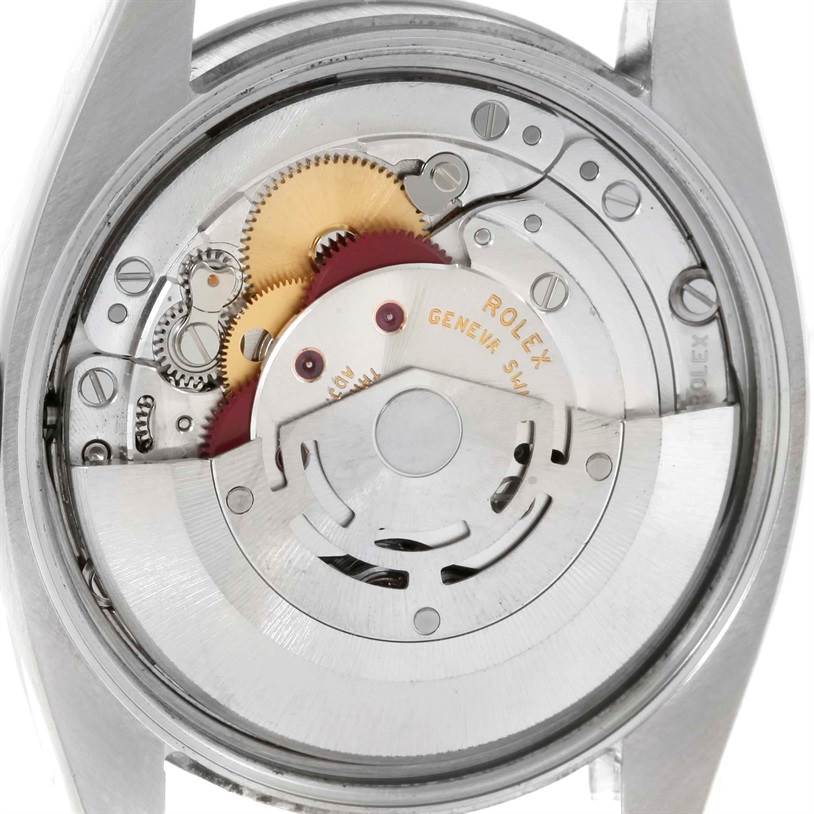 The image shows the movement and internal mechanisms of a Rolex Air-King 114210 Men's Stainless Steel Blue Dial 114210 Men's Stainless Steel Blue Dial watch from a back angle.