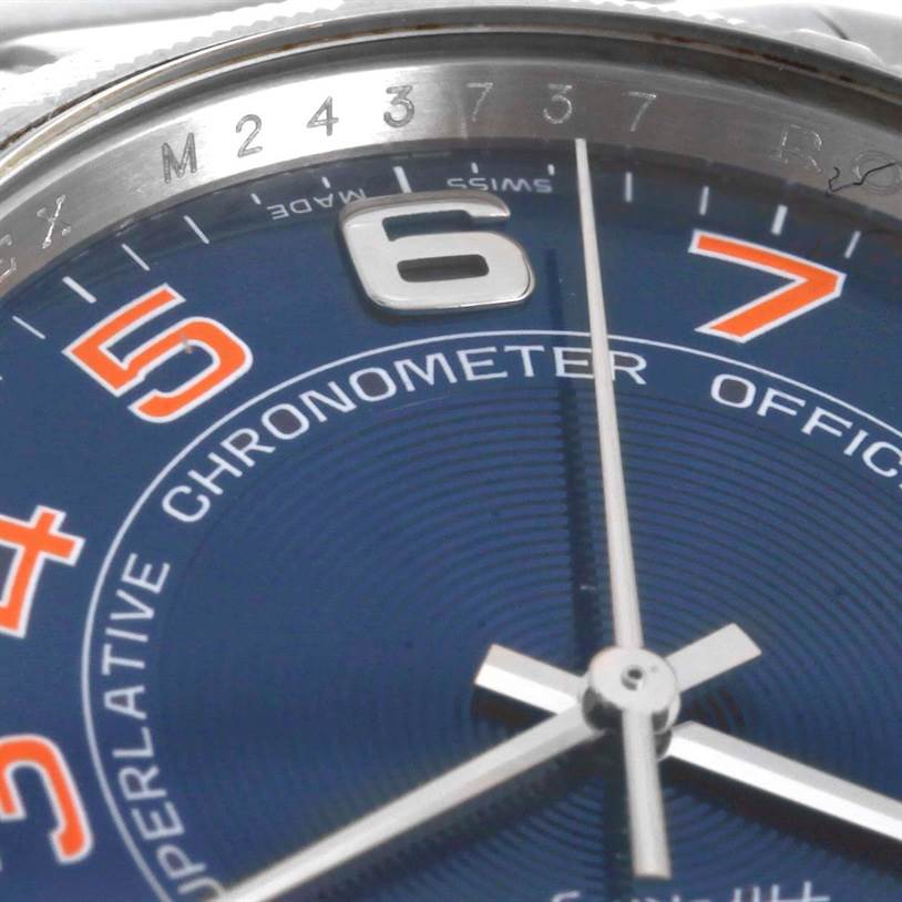 This close-up of a Rolex Air-King 114210 Men's Stainless Steel Blue Dial 114210 Men's Stainless Steel Blue Dial watch shows the dial, Arabic numerals, hands, and part of the bezel.