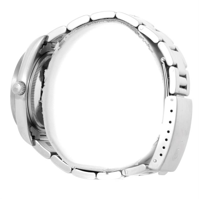 The image shows a side angle of the Rolex Air-King 14010 Men's Stainless Steel Silver Dial 14010 Men's Stainless Steel Silver Dial watch, focusing on its bracelet, clasp, and crown.