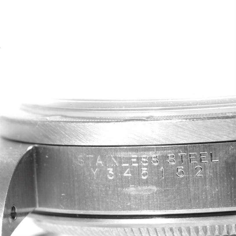This image shows a side view of the casing of the Rolex Air-King 14010 Men's Stainless Steel Silver Dial 14010 Men's Stainless Steel Silver Dial watch with stainless steel markings and a serial number.