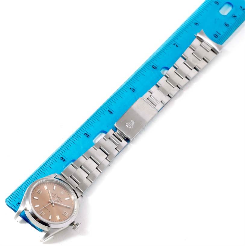 The image shows a Rolex Air-King 14000 Men's Stainless Steel Pink Dial 14000 Men's Stainless Steel Pink Dial watch, displaying its full face and metal bracelet, measured against a blue ruler.