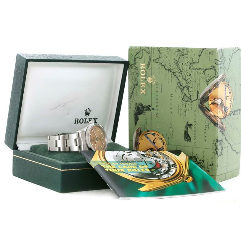 The image shows a Rolex Air-King 14000 Men's Stainless Steel Pink Dial 14000 Men's Stainless Steel Pink Dial watch in its open box with accompanying booklets and packaging.