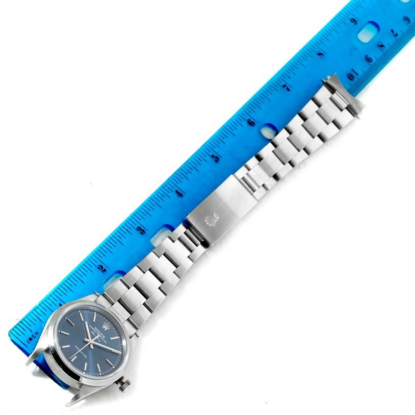 The image shows a Rolex Air-King 14000 Men's Stainless Steel Blue Dial 14000 Men's Stainless Steel Blue Dial watch laid flat next to a ruler, displaying its face, bracelet, and clasp from a top-down angle.