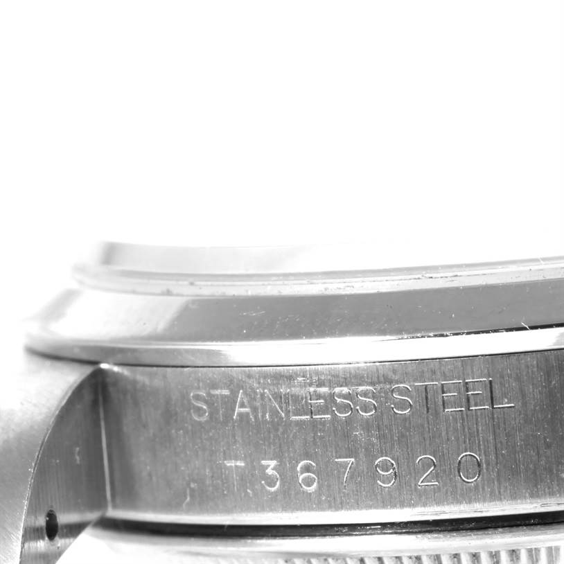 The image shows a close-up side view of the stainless steel casing of a Rolex Air-King 14000 Men's Stainless Steel Blue Dial 14000 Men's Stainless Steel Blue Dial watch, with part of the engraving visible.