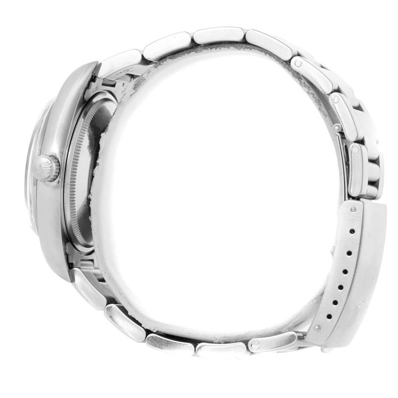 The image shows a side profile of a Rolex Air-King 14000 Men's Stainless Steel Blue Dial 14000 Men's Stainless Steel Blue Dial watch, highlighting its case, crown, and metal bracelet.