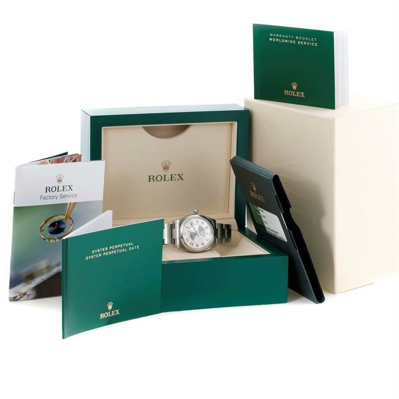 The image shows a Rolex Air-King 114200 Men's Stainless Steel Silver Dial 114200 Men's Stainless Steel Silver Dial watch with its green box, booklets, and warranty cards, viewed from the front.