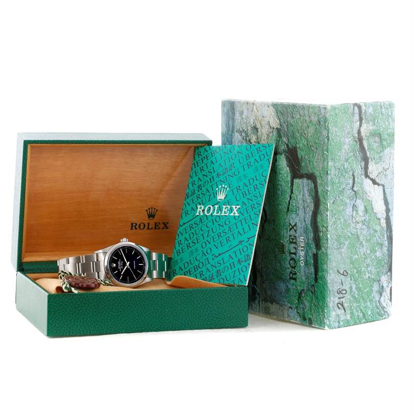 The image shows a Rolex Air-King 14000 Men's Stainless Steel Black Dial 14000 Men's Stainless Steel Black Dial watch inside its open green box with additional accessories, booklets, and outer packaging.