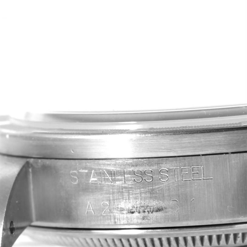 The image shows a close-up side angle of the casing of a Rolex Air-King 14010 Men's Stainless Steel Blue Dial 14010 Men's Stainless Steel Blue Dial watch, highlighting the "Stainless Steel" engraving.