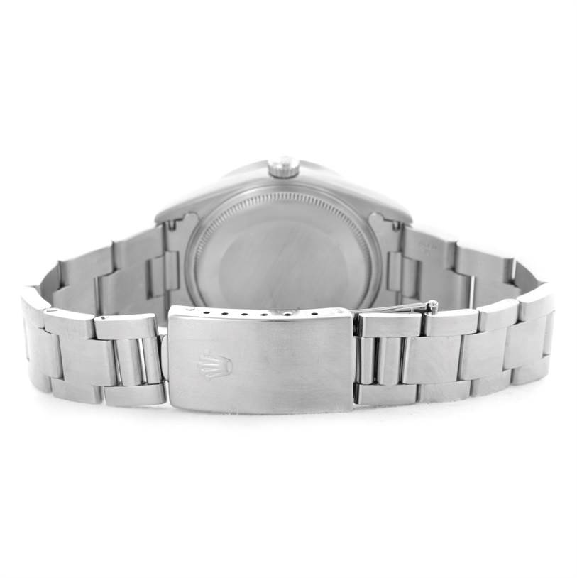 This image shows the back of a Rolex Air-King 14010 Men's Stainless Steel Blue Dial 14010 Men's Stainless Steel Blue Dial watch, including the case back and the clasp of the bracelet.