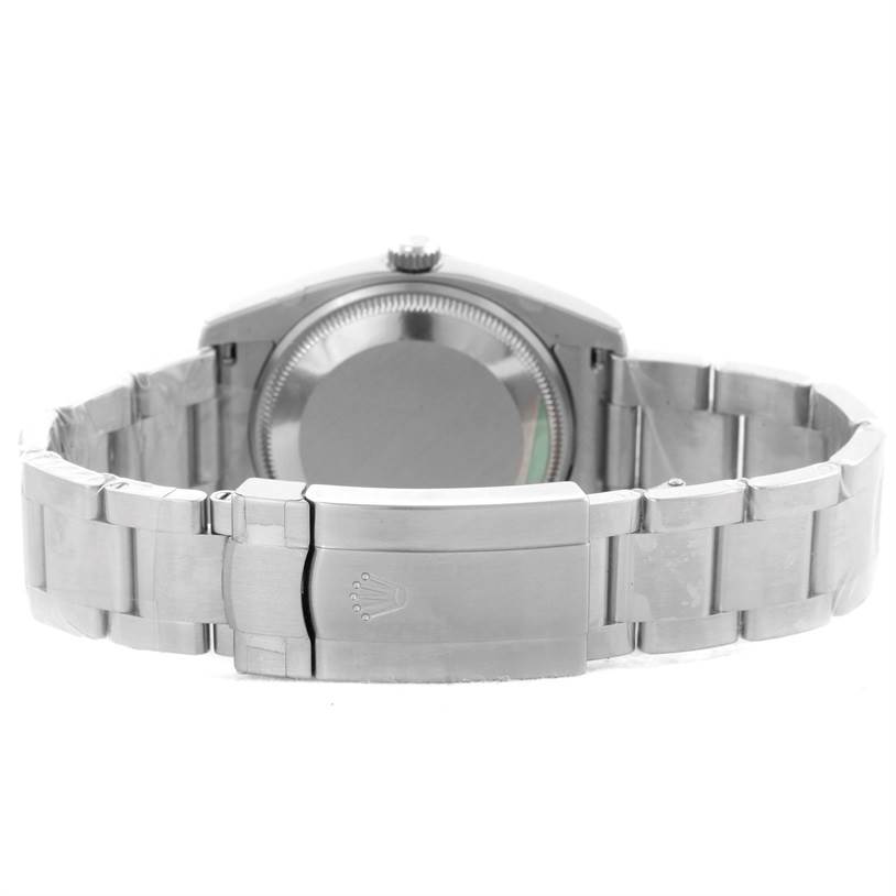 The image shows the back view of a Rolex Air-King 114200 Men's Stainless Steel Blue Dial 114200 Men's Stainless Steel Blue Dial watch, highlighting the case back and metal bracelet with the clasp open.