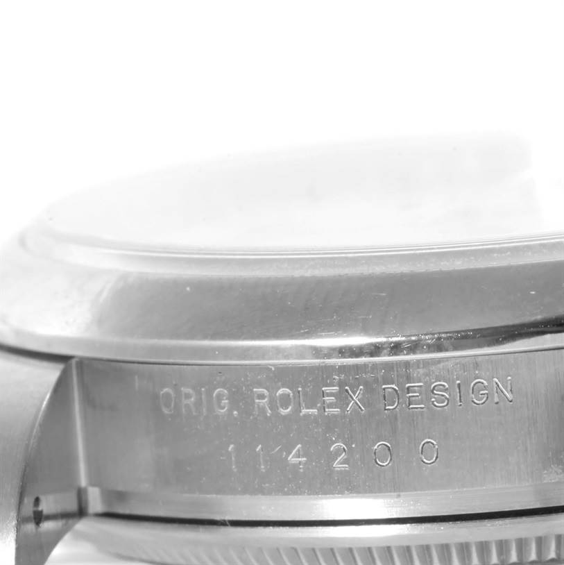This image shows a close-up side view of the case and bezel of a Rolex Air-King 114200 Men's Stainless Steel White Dial 114200 Men's Stainless Steel White Dial watch, featuring its model number.