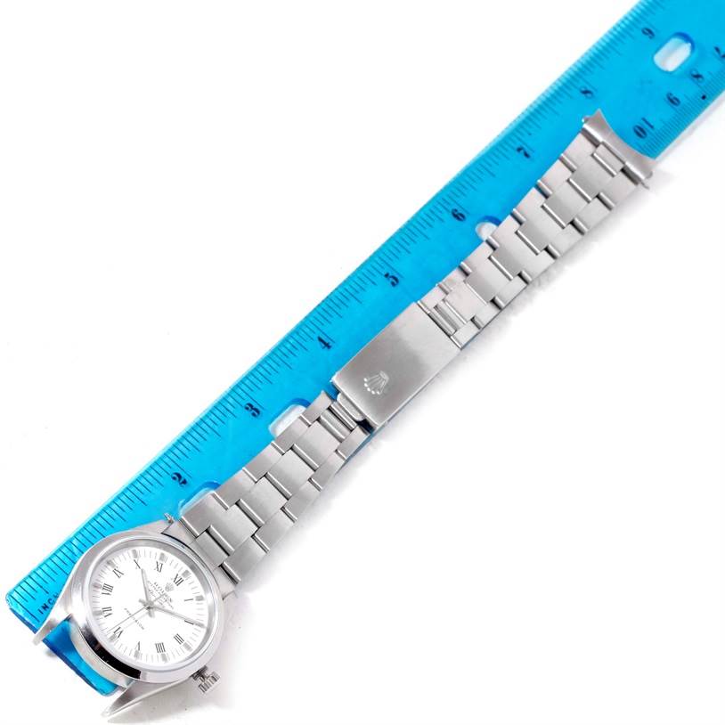 The image shows a Rolex Air-King 14000 Men's Stainless Steel White Dial 14000 Men's Stainless Steel White Dial watch with a metal bracelet, measured with a blue ruler for scale.