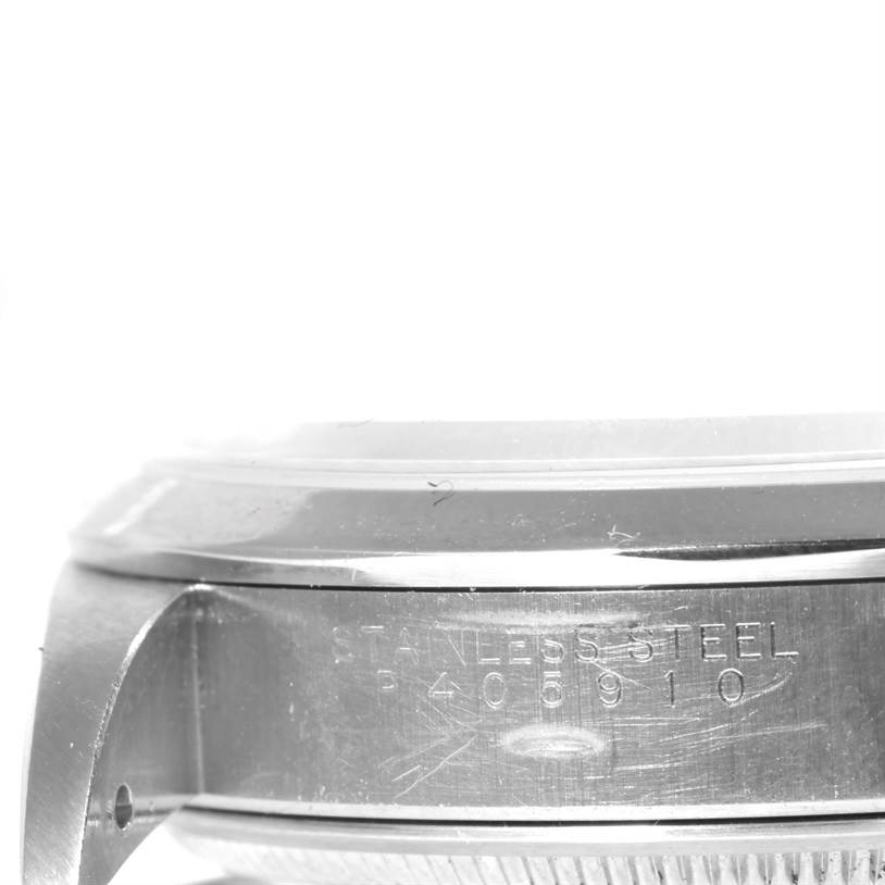 This is a close-up side view of the Rolex Air-King 14000 Men's Stainless Steel White Dial 14000 Men's Stainless Steel White Dial watch showing the stainless steel case with engraved serial numbers.