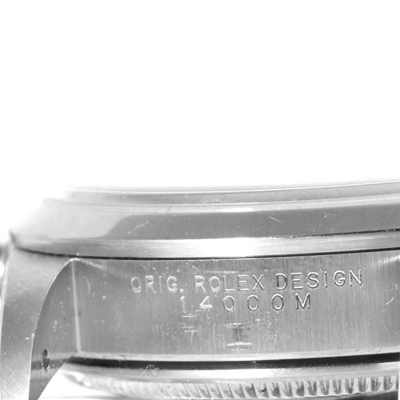 This close-up image shows the side of the Rolex Air-King 14000 Men's Stainless Steel Blue Dial 14000 Men's Stainless Steel Blue Dial watch case, engraved with "ORIG. ROLEX DESIGN 14000M."