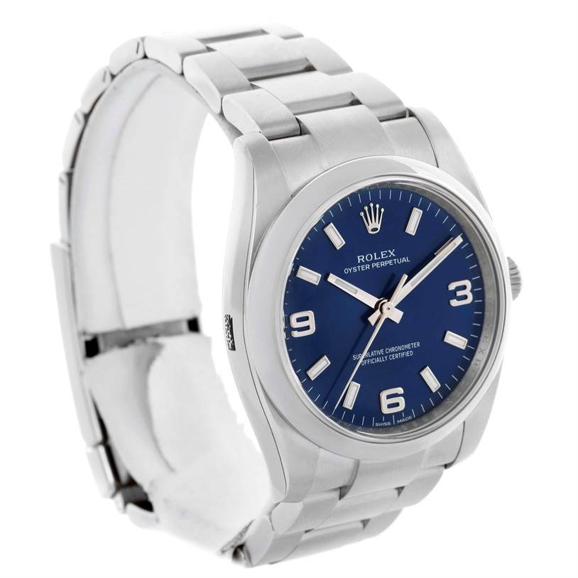 The Rolex Air-King 114200 Men's Stainless Steel Blue Dial 114200 Men's Stainless Steel Blue Dial watch is shown at a slightly angled side view, displaying its face, bezel, and bracelet.