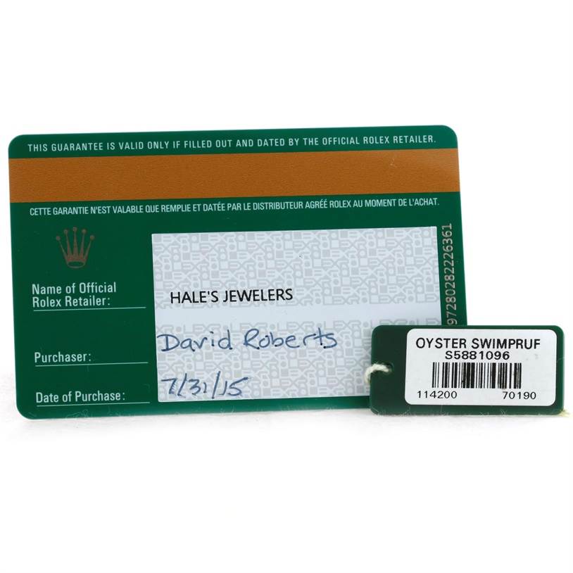 The image shows the warranty and authentication card for the Rolex Air-King 114200 Men's Stainless Steel Blue Dial 114200 Men's Stainless Steel Blue Dial model, along with a green Oyster Swimpruf tag.