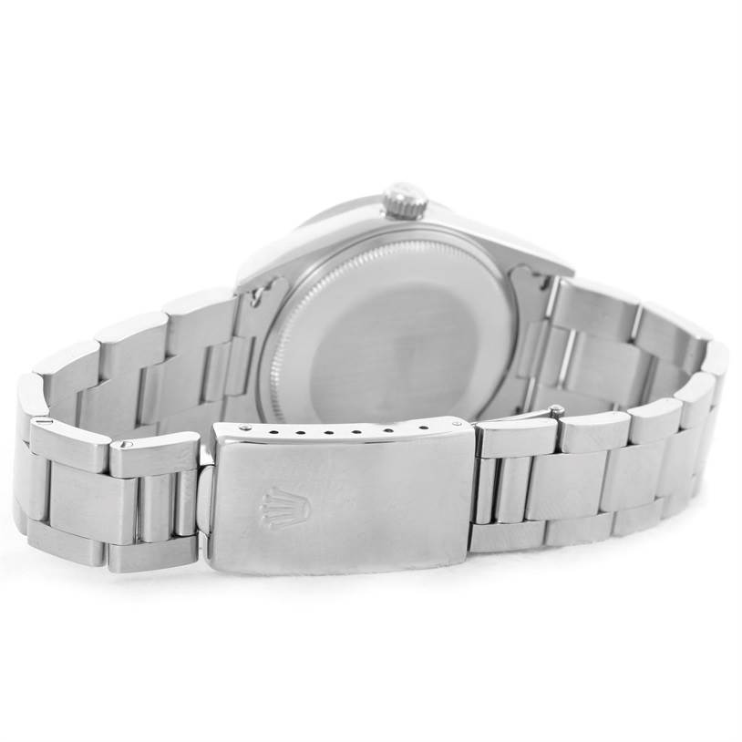 The image shows the backside and metal bracelet clasp of a Rolex Air-King 14010 Stainless Steel Blue Dial 14010 Stainless Steel Blue Dial watch.