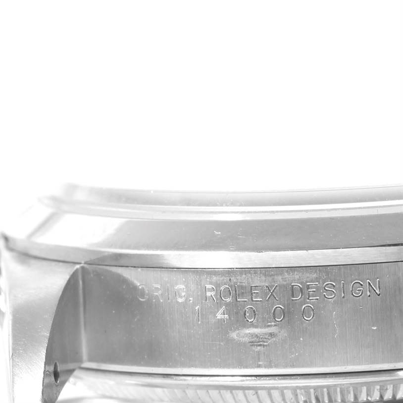 This image shows a close-up of the engraved side of the Rolex Air-King 14000 Men's Stainless Steel Blue Dial 14000 Men's Stainless Steel Blue Dial watch case, displaying the model number.