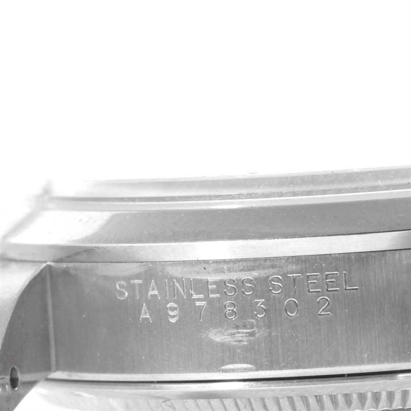 This image shows a close-up of the side of the case and serial number of a Rolex Air-King 14000 Men's Stainless Steel Blue Dial 14000 Men's Stainless Steel Blue Dial watch.
