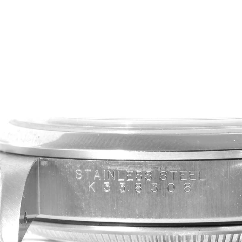 This image shows a close-up side view of the Rolex Air-King 14000 Men's Stainless Steel Black Dial 14000 Men's Stainless Steel Black Dial watch case, highlighting the stainless steel and engraved serial number.
