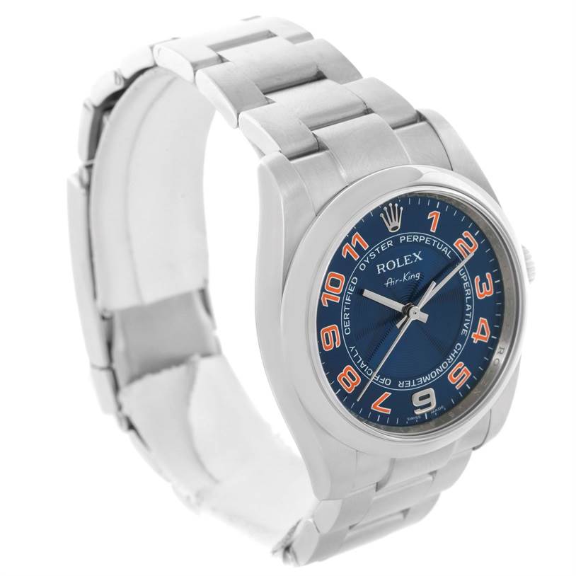 The image shows a Rolex Air-King 114200 Men
s Stainless Steel Blue Dial 114200 Men
s Stainless Steel Blue Dial watch at a three-quarter angle, displaying the face, bezel, and part of the bracelet.