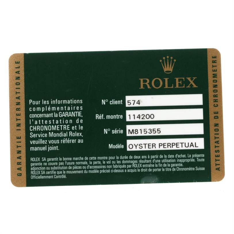 This image shows a warranty card for a Rolex Oyster Perpetual model, reference 114200, with client number 574 and serial number M815355.