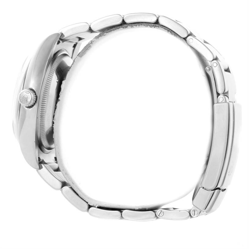 This image shows a side view of the Rolex Air-King 114200 Men's Stainless Steel Pink Dial 114200 Men's Stainless Steel Pink Dial, displaying the crown, case, and bracelet.