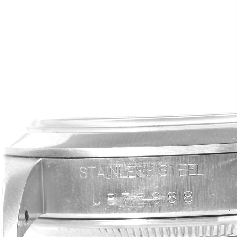 This image shows a close-up side view of the case and lugs of a Rolex Air-King 14000 Men's Stainless Steel Black Dial 14000 Men's Stainless Steel Black Dial watch, featuring its stainless steel marking and serial number.