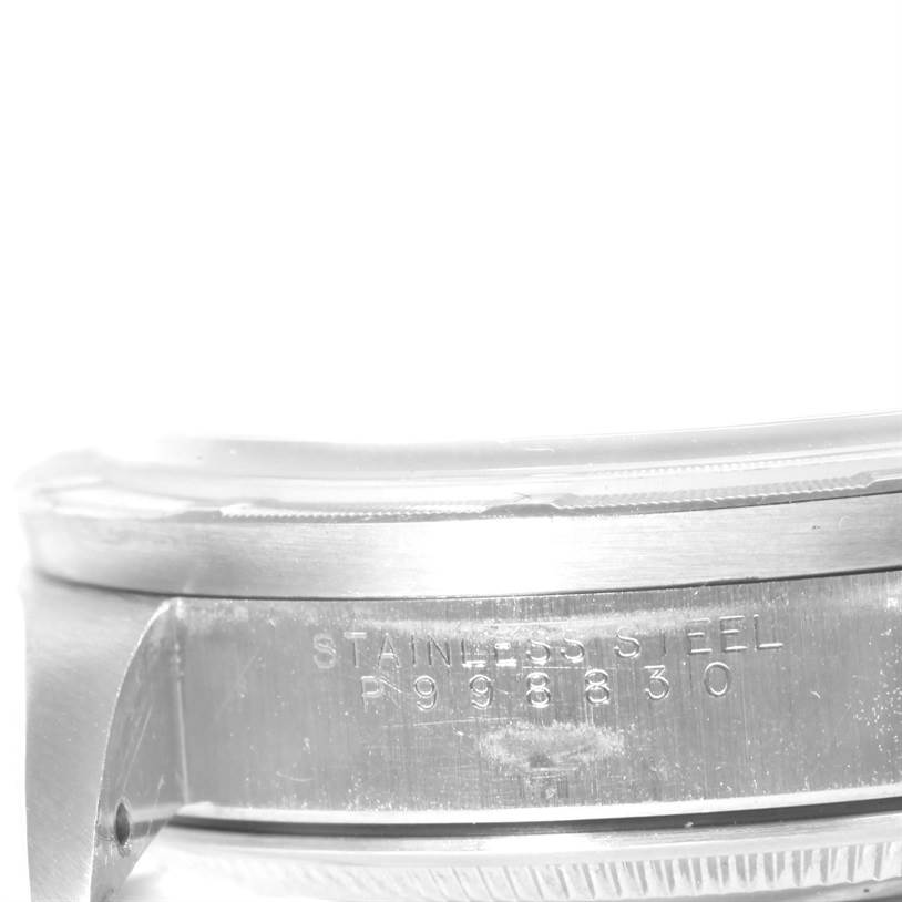 This image shows a close-up angled view of the side casing and serial number of a Rolex Air-King 14010 Men's Stainless Steel Blue Dial 14010 Men's Stainless Steel Blue Dial watch.