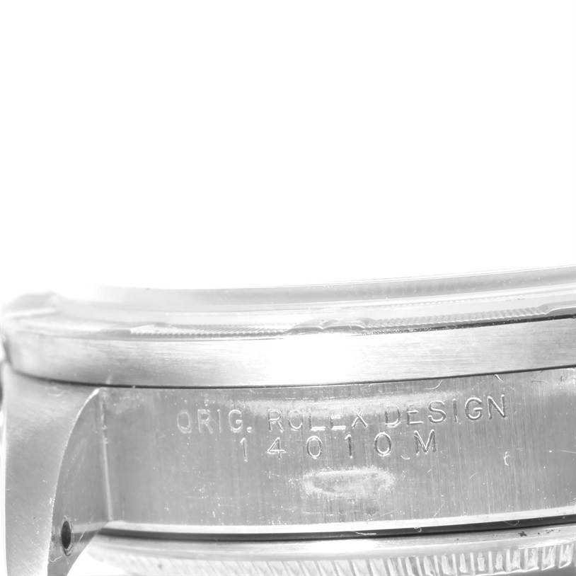 The image shows a close-up angle of the side of a Rolex Air-King 14010 Men's Stainless Steel Blue Dial 14010 Men's Stainless Steel Blue Dial watch case with detailed engravings.