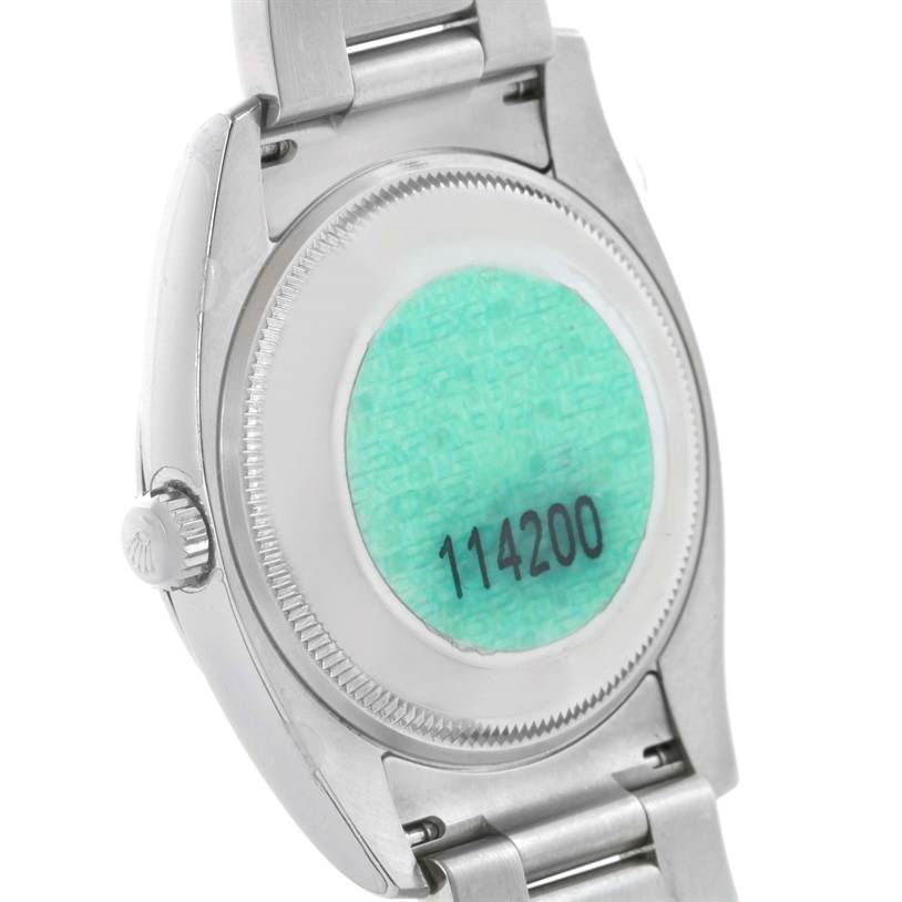 The image shows the back case and partial bracelet of the Rolex Air-King 114200 Men's Stainless Steel White Dial 114200 Men's Stainless Steel White Dial model 114200.