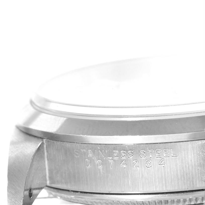 The image shows a close-up of the side of a Rolex Air-King 14000 Men's Stainless Steel Silver Dial 14000 Men's Stainless Steel Silver Dial watch, highlighting the stainless steel case and serial number.
