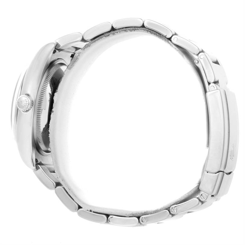 The image shows a side view of the Rolex Air-King 114200 Men's Stainless Steel Blue Dial 114200 Men's Stainless Steel Blue Dial watch, highlighting its band, crown, and case.