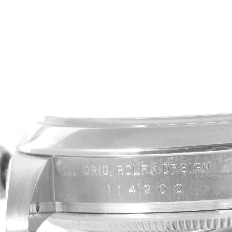 The image shows a close-up side view of the case and caseback of a Rolex Air-King 114200 Men's Stainless Steel Blue Dial 114200 Men's Stainless Steel Blue Dial, displaying the model's inscription and design number.