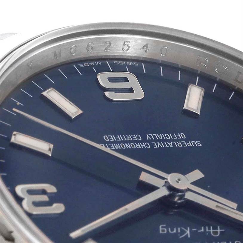 The image shows a close-up view of the dial and part of the bezel of a Rolex Air-King 114200 Men's Stainless Steel Blue Dial 114200 Men's Stainless Steel Blue Dial watch.