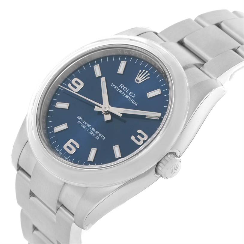This Rolex Air-King 114200 Men's Stainless Steel Blue Dial 114200 Men's Stainless Steel Blue Dial watch is shown at a slight angle, displaying its blue dial, numerals, hands, bezel, crown, and part of the bracelet.