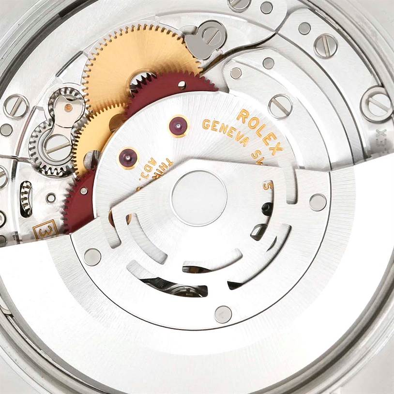 This image shows a close-up of the mechanical movement inside a Rolex Air-King 114200 Men's Stainless Steel Blue Dial 114200 Men's Stainless Steel Blue Dial watch, highlighting gears and intricate components.