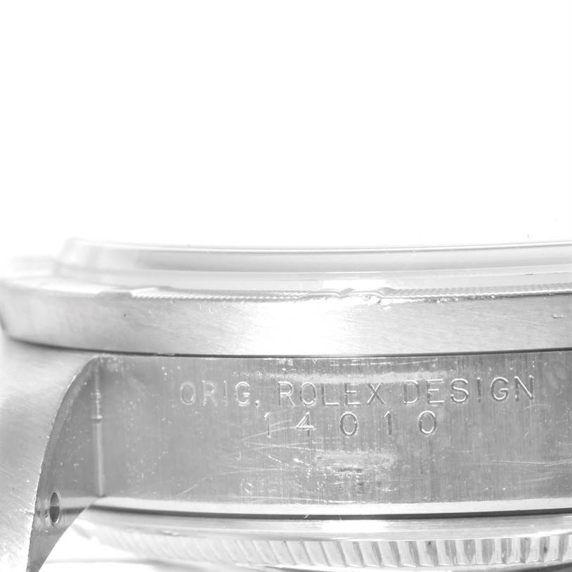 This image shows a side close-up of the case's serial engraving on a Rolex Air-King 14010 Stainless Steel Pink Dial 14010 Stainless Steel Pink Dial watch.