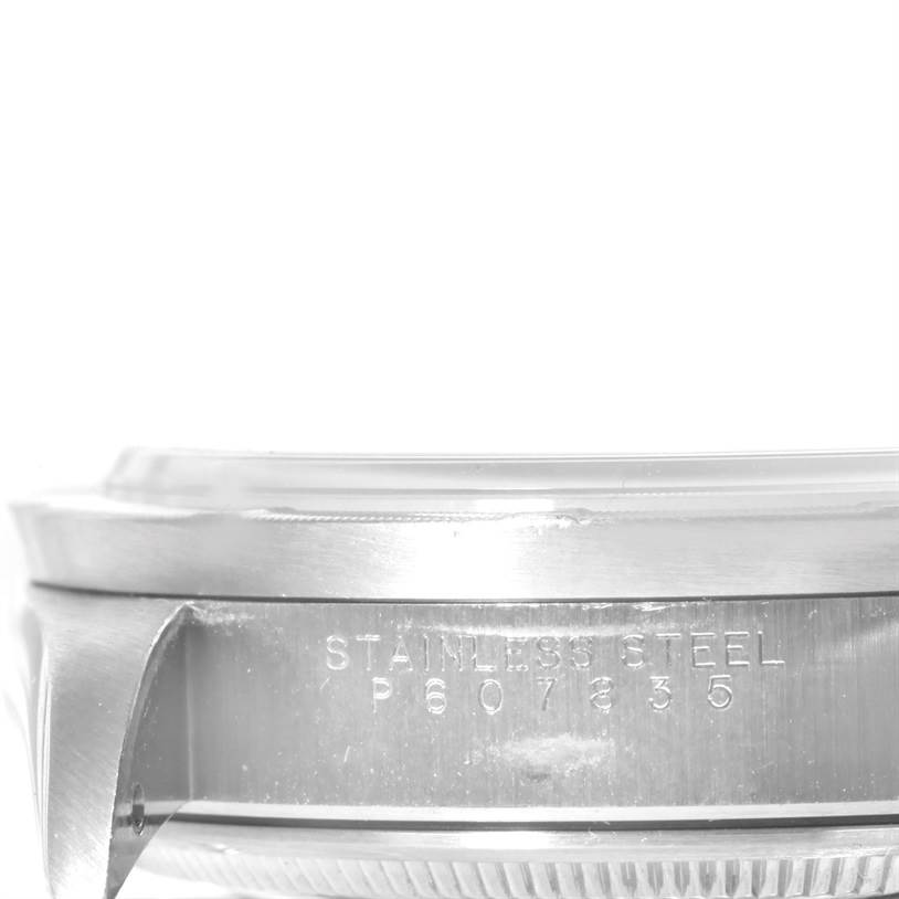 The image shows a close-up of the side engraving and bezel of a Rolex Air-King 14010 Stainless Steel Pink Dial 14010 Stainless Steel Pink Dial watch.