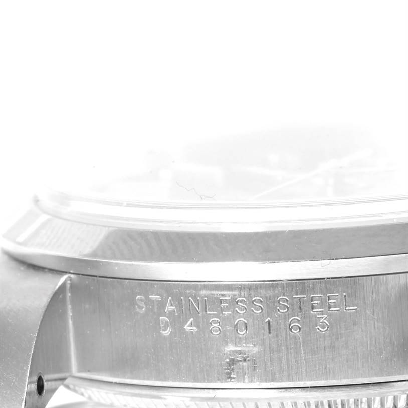 This image shows a close-up side view of the stainless steel case of a Rolex Air-King 14000 Men's Stainless Steel Blue Dial 14000 Men's Stainless Steel Blue Dial watch, displaying the serial number.