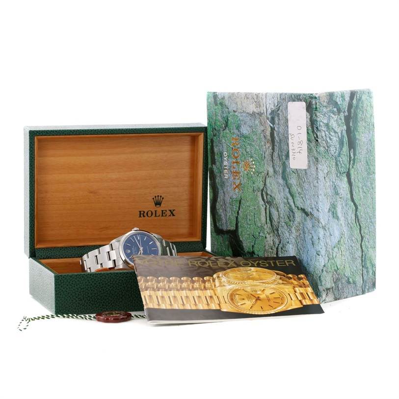 The image shows a Rolex Air-King 14000 Men's Stainless Steel Blue Dial 14000 Men's Stainless Steel Blue Dial watch at an oblique angle with its box, manual, and warranty card.